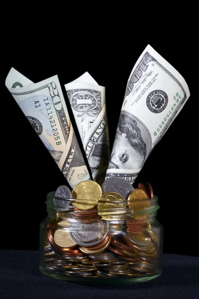 US dollars in a glass can — Stock Photo, Image