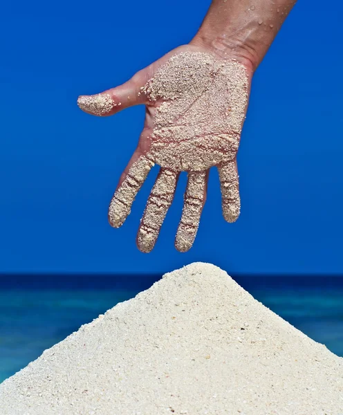 Women hand with sticking sand — Stock Photo, Image