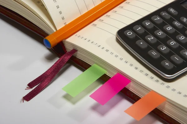 Notebook with pen and calculator — Stock Photo, Image