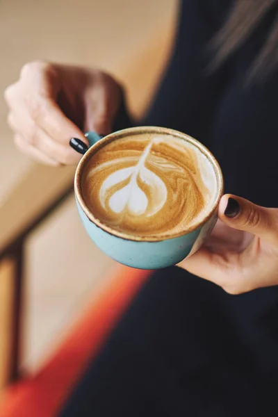 Cup of coffee on wooden table in cafe. Top view — Stock Photo, Image