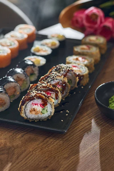 Set of sushi in a restaurant on the table. Sushi menu. Japanese food.