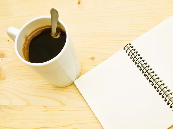 Cup of coffe and spiral note book — Stock Photo, Image