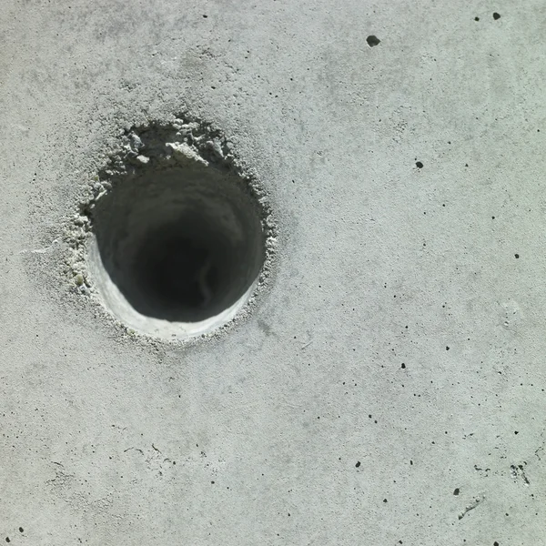 Hole in beton — Stockfoto