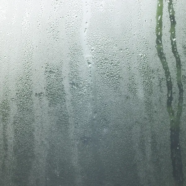Chuva em uma janela — Fotografia de Stock