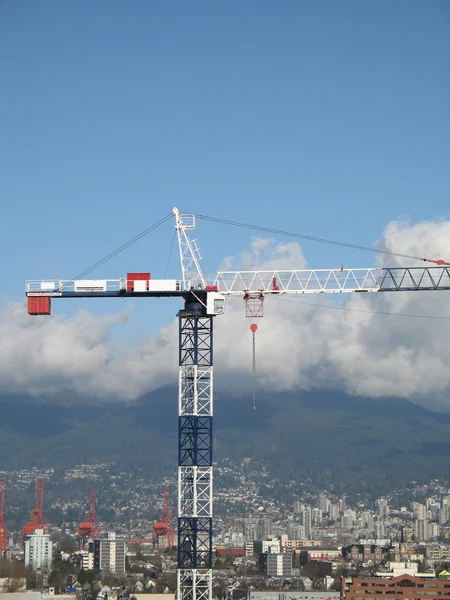 Construction crane and cityscape — Stock Photo, Image