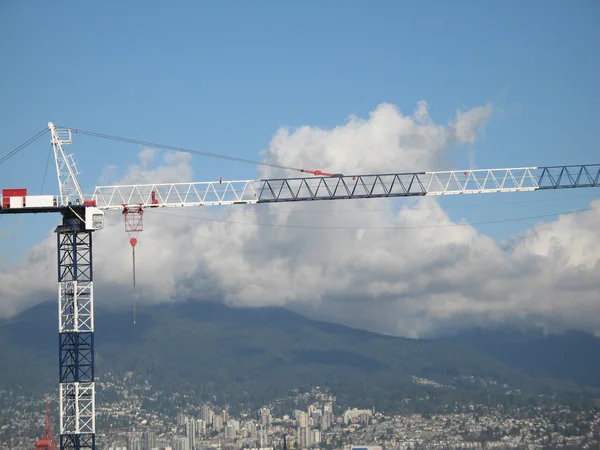 Construction crane and cityscape — Stock Photo, Image