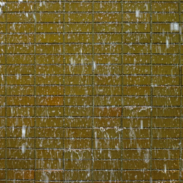 Water cascading down on bricks — Stock Photo, Image