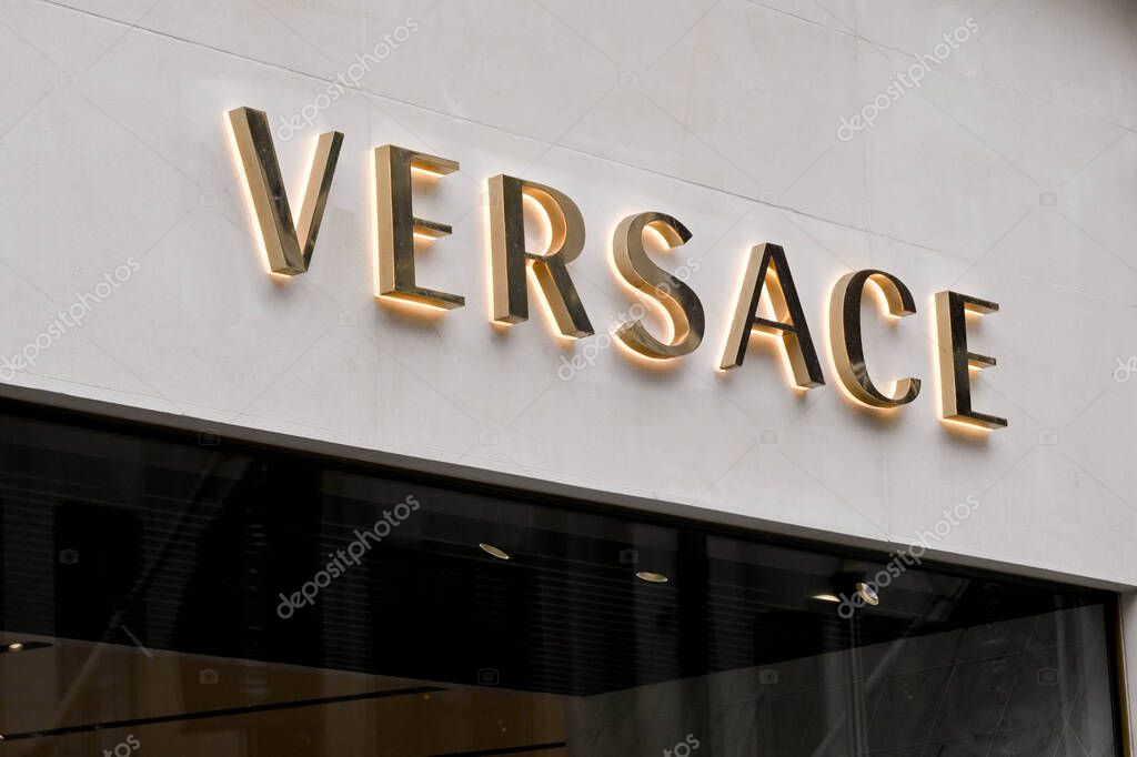London, England - June 2020: Sign above the entrance to the Versace designer fashion store in New Bond Street.