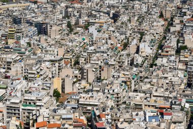 Athens, Greece - May 2022: Aerial view of homes and buildings packed tightly together in the city centre
