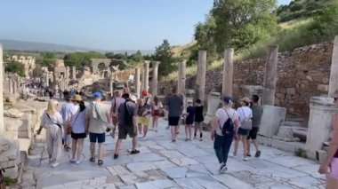 Ephesus, Kusadasi, Turkey  May 2022: Visitors walking through the ruins of the ancient Roman Empire city of Ephesus