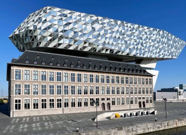 Antwerp, Belgium - August 2022: Exterior of the Antwerp Port Authority building in the city's commercial docks. The architect was Zaha Hadid.