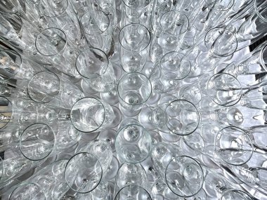 Rows of empty champagne flute glasses viewed from above. No people.