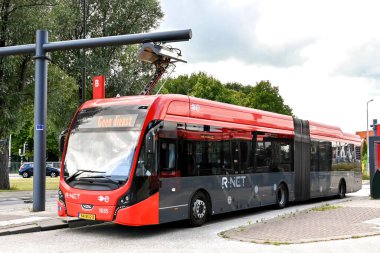 Edam, Netherlands - August 2022: Electric bus at the town's bus station recharging its batteries using a rapid overhead charging connection