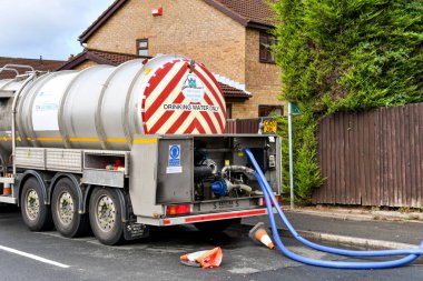 Pontypridd, Wales - August 2022: Rear view of a water tanker being used to provide water to residents without any water due to a burst main