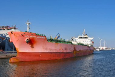Antwerp, Belgium - August 2022: Large oil tanker moored in the city's commercial port. It is a major port for unloading oil for Europe.
