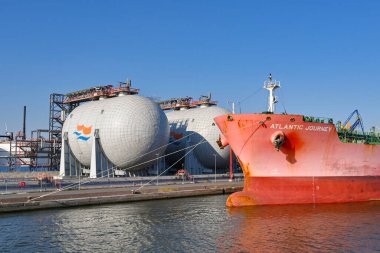 Antwerp, Belgium - August 2022: Large oil tanker moored in the city's commercial port. It is a major port for unloading oil for Europe.