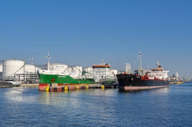 Antwerp, Belgium - August 2022: Large oil tankers moored in the city's commercial port. It is a major port for unloading oil for Europe.