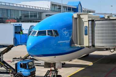 Amsterdam, Netherlands - August 2022: KLM Boeing 777 jet being loaded with catering supplies using a scissor lift truck at Schipol airport