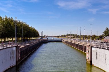 Veere, Netherlands - August 2022: Entrance to the canal lock near the town with lock gates open