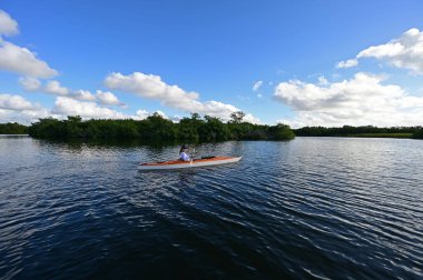 Woman kayaking on Paurotis Pond in Everglades National Park, Florida.