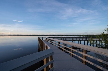 Sunrise cloudscape over West Lake boardwalk in Everglades National Park, Florida on calm summer morning.