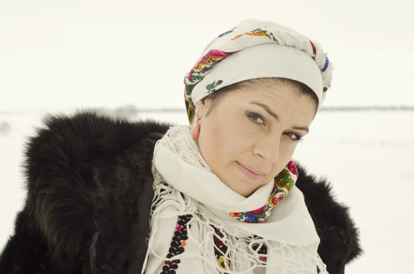 Woman in traditional ukrainian cloth on snow — Stock Photo, Image