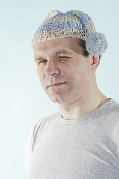Portrait of man in dwarf cap with one closed eye — Stock Photo, Image