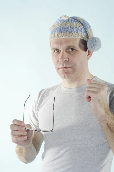 Portrait of man in dwarf cap with glasses — Stock Photo, Image