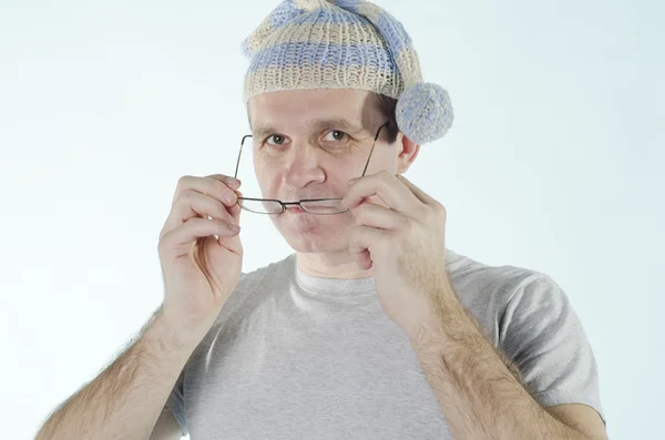 Portrait of man in dwarf cap with glasses — Stock Photo, Image