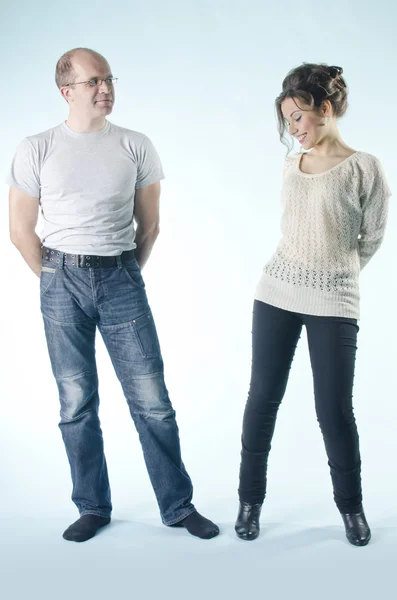 Portrait of man and girl standing in various poses — Stock Photo, Image