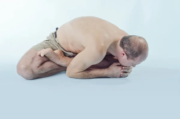 Portrait of man in yoga pose — Stock Photo, Image