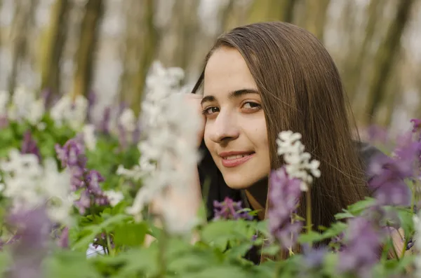 Portrait of beautiful girl in corydalis — Stock Photo, Image