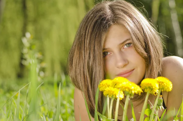 Portrait of beautiful girl with dandelions — Stock Photo, Image