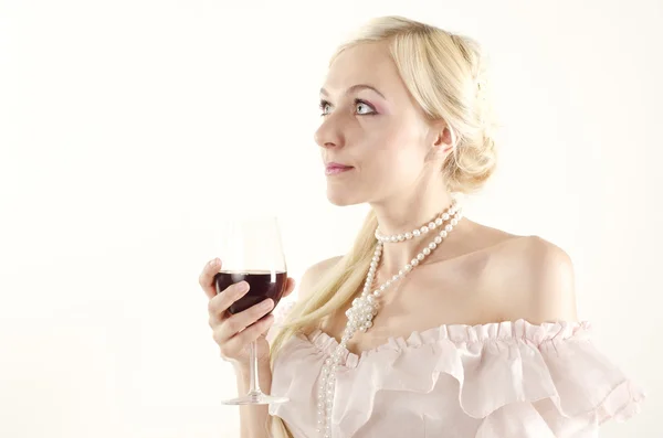 Studio portrait of beautiful woman dressed in old fashionable style with glass of wine — Stock Photo, Image