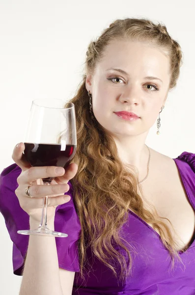 Studio portrait of a beautiful, attractive girl with a glass of red wine and dressed like an old fashionable lady on white background — Stock Photo, Image