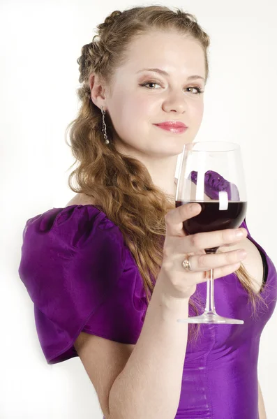 Studio portrait of a beautiful, attractive girl with a glass of red wine and dressed like an old fashionable lady on white background — Stock Photo, Image