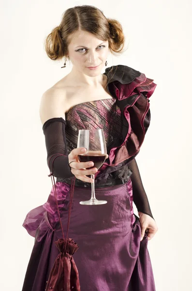 Studio portrait of beautiful woman dressed in old fashinable style with a glass of wine — Stock Photo, Image