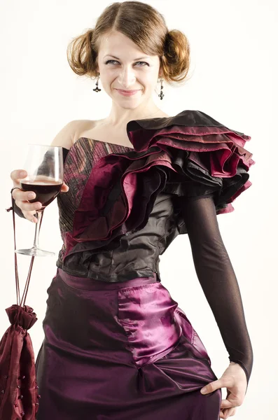 Studio portrait of beautiful woman dressed in old fashinable style with a glass of wine — Stock Photo, Image