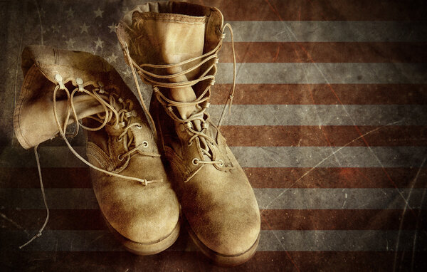 US Army boots on the old paper flag. 4th of july background