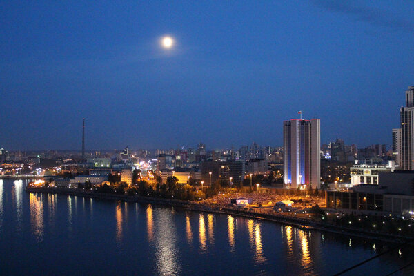 View of the city at night from a height. The City Of Ekaterinburg. Night, the lights, the promenade, the reflection in the water