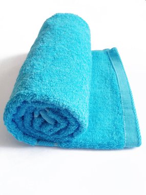 blue rolled towel on white background