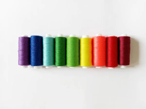 Sewing Threads Arranged Rainbow Order White Background — Stockfoto