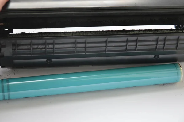 Charging the laser printer cartridge with toner the powder