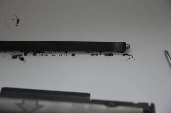 Charging the laser printer cartridge with toner the powder