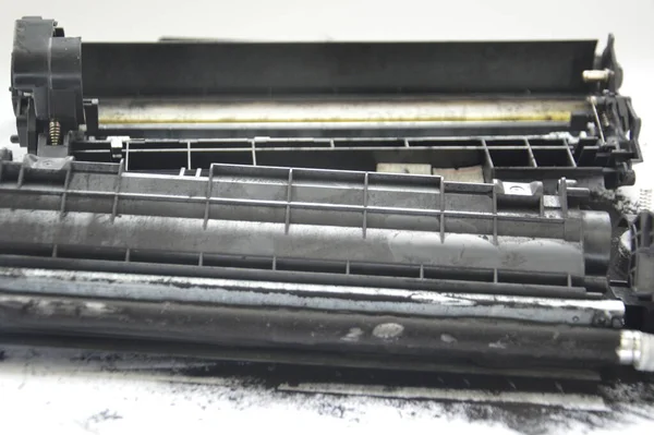 Charging the laser printer cartridge with toner the powder