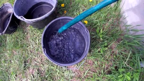 Water Pouring Well Plastic Buckets — Stockvideo