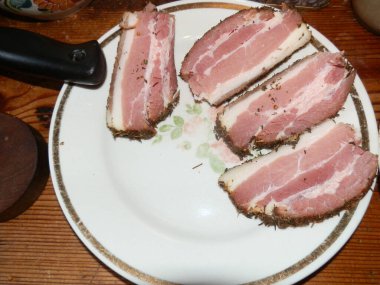 Slicing sausages and boiled a pork