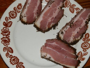 Slicing sausages and boiled a pork