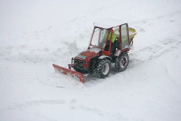 A snowplow clearing a road Stock Picture