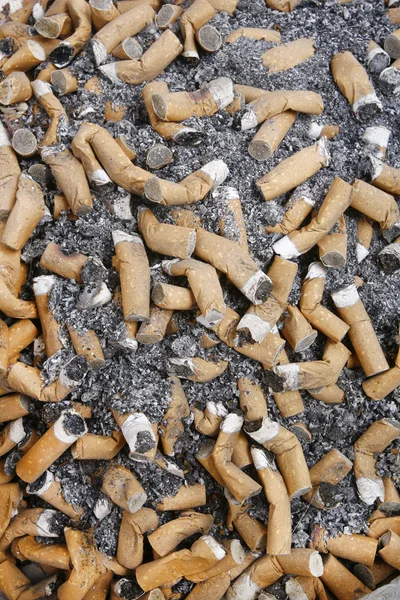 Many cigarette smoked in the crowd of — Stock Photo, Image